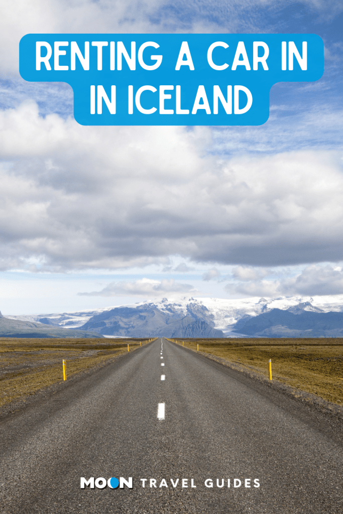 Image of road leading to snowy mountains with text Renting a Car in Iceland